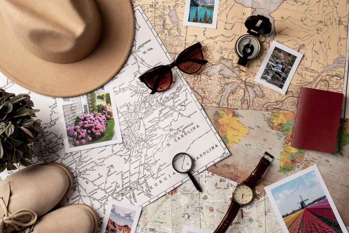 A view of a world travel map accompanied by travel essentials