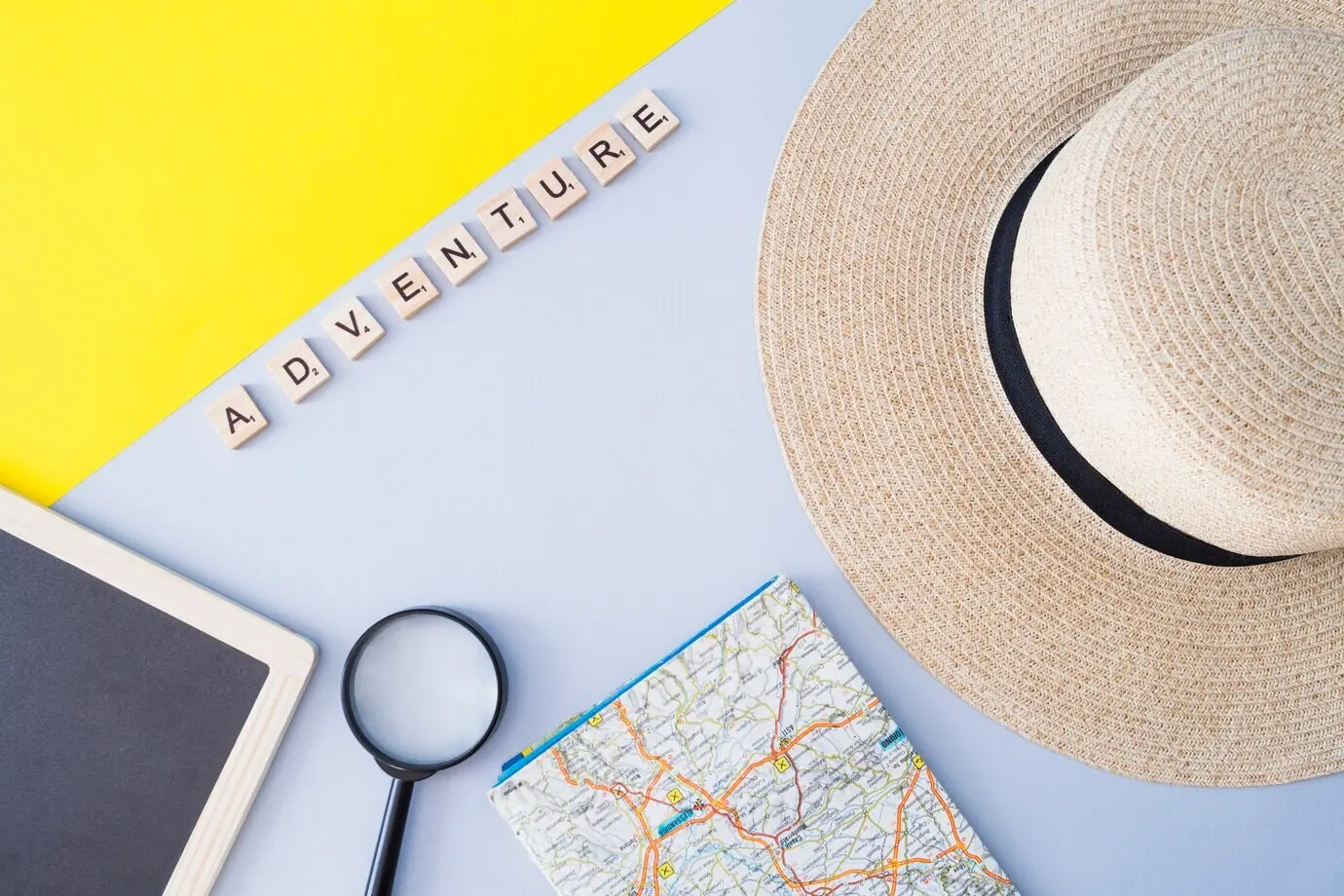 An arrangement of travel-related elements with letters